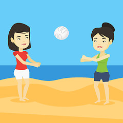 Image showing Two women playing beach volleyball.