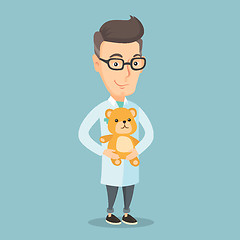 Image showing Pediatrician doctor holding teddy bear.