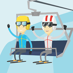 Image showing Two happy skiers using cableway at ski resort.