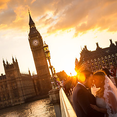 Image showing Traffic and random people on Westminster Bridge in sunset, London, UK.