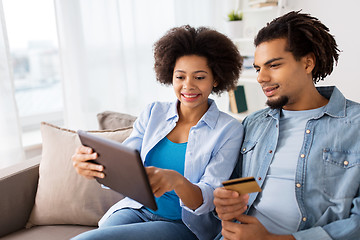 Image showing couple with tablet pc and credit card at home