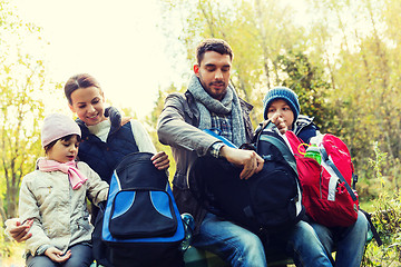 Image showing happy family with backpacks at camp