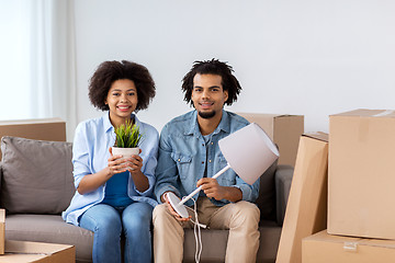 Image showing happy couple with stuff moving to new home