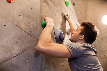 Image showing young man exercising at indoor climbing gym