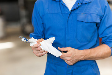 Image showing auto mechanic or smith with wrench at car workshop