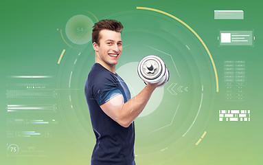 Image showing happy sportive young man with dumbbell