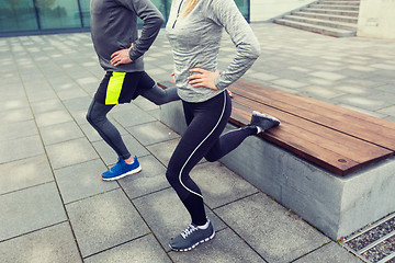 Image showing close up of couple doing lunge exercise on street