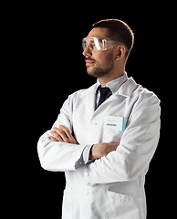 Image showing doctor or scientist in lab coat and safety glasses