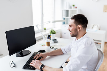 Image showing businessman typing on computer keyboard at office