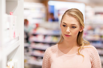 Image showing young woman at pharmacy