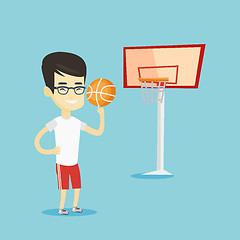 Image showing Young basketball player spinning ball.