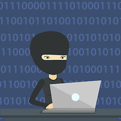 Image showing Hacker using laptop to steal information.