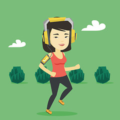 Image showing Woman running with earphones and smartphone.