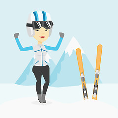 Image showing Cheerful skier standing with raised hands.