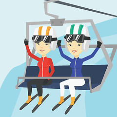 Image showing Two happy skiers using cableway at ski resort.