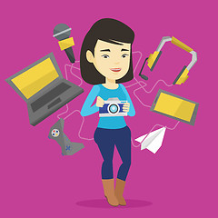 Image showing Young woman surrounded with her gadgets.