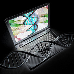 Image showing Laptop with dna medical model background on laptop screen. 3d il