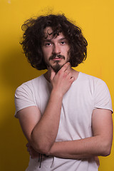 Image showing young man with funny hair over color background