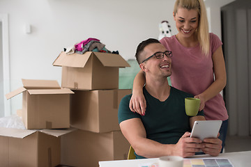 Image showing Young couple moving in a new home