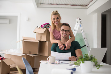 Image showing Young couple moving in a new home