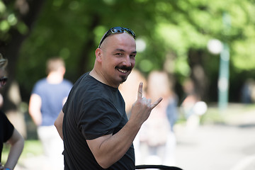 Image showing man showing a rock hand gesture