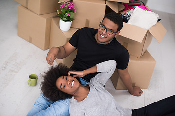 Image showing African American couple relaxing in new house