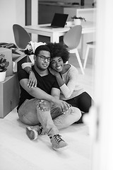 Image showing African American couple relaxing in new house