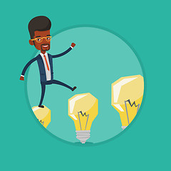 Image showing Businessman jumping on light bulbs.