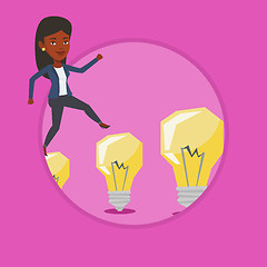 Image showing Business woman jumping on light bulbs.