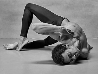 Image showing The male ballet dancer posing over gray background