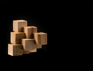 Image showing The wooden puzzle - game with blocks