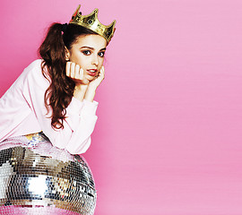 Image showing young cute disco girl on pink background with disco ball and cro