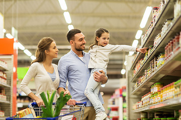 Image showing family with food in shopping cart at grocery store