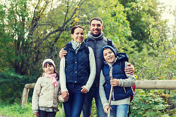 Image showing happy family with backpacks hiking