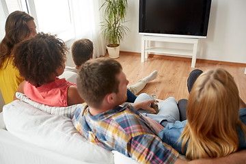 Image showing friends with beer watching tv at home