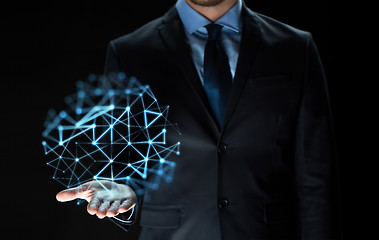 Image showing close up of businessman with network projection