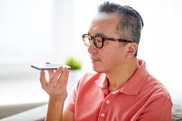 Image showing man using voice command recorder on smartphone