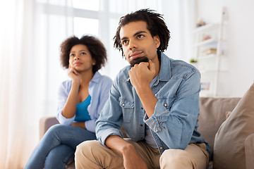 Image showing happy couple sitting on sofa at home