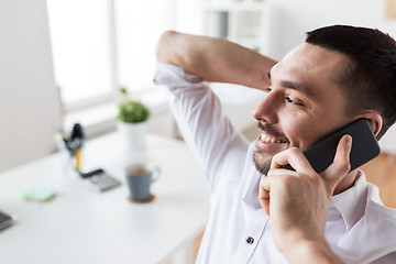 Image showing businessman calling on smartphone at office