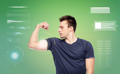 Image showing sportive man showing bicep power