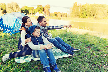 Image showing happy family with tent at camp site