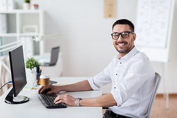 Image showing businessman typing on computer keyboard at office