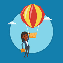 Image showing Business woman hanging on balloon.