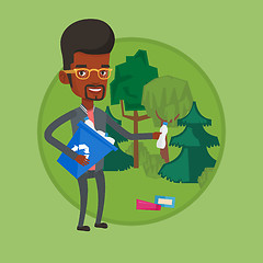 Image showing Man collecting garbage in forest.