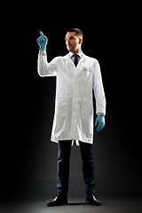 Image showing doctor or scientist in lab coat and medical gloves