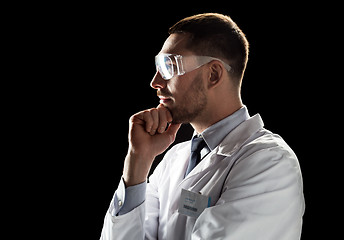 Image showing doctor or scientist in lab coat and safety glasses