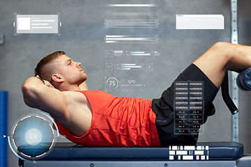 Image showing young man making abdominal exercises in gym