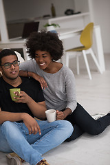 Image showing African American couple relaxing in new house