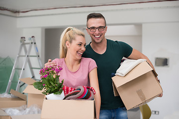 Image showing young couple moving into a new home