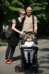 Image showing couple with baby pram in summer park